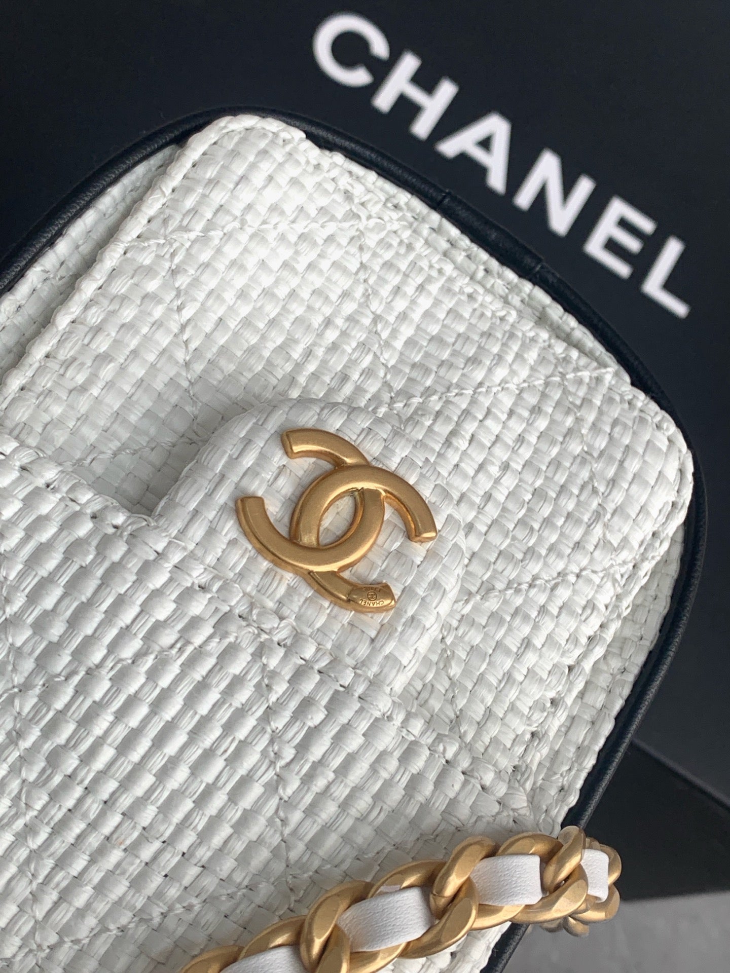 Chanel 25 Cream White braided raffia texture close-up