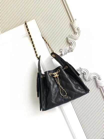 Black handbag with gold chain on a white background Chanel 25 Small Hobo Black front viewChanel 25 Small Hobo 
